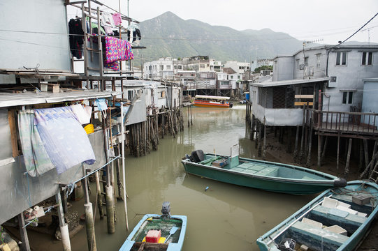 Boats and elevated houses in Chinese fishing village in Tai O, Hong Kong, China