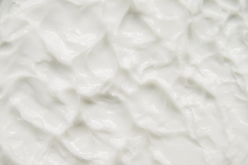 Cosmetics. Cream white background texture.