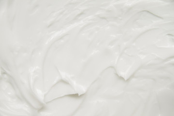 Cosmetics. Cream white background texture.