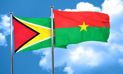 Guyana flag with Burkina Faso flag, 3D rendering