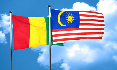 Guinea flag with Malaysia flag, 3D rendering