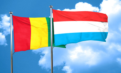 Guinea flag with Luxembourg flag, 3D rendering