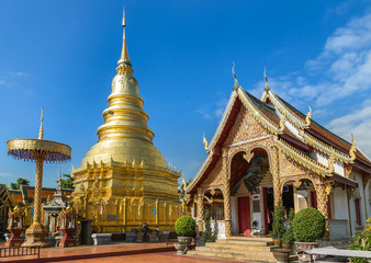 Fototapeta premium golden pagoda in wat phra that hariphunchai temple at lamphun thailand