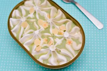  Cropped top view image of pistachio ice cream on table background, close up flat lay 