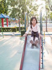 Happy kid, asian baby child playing on playground