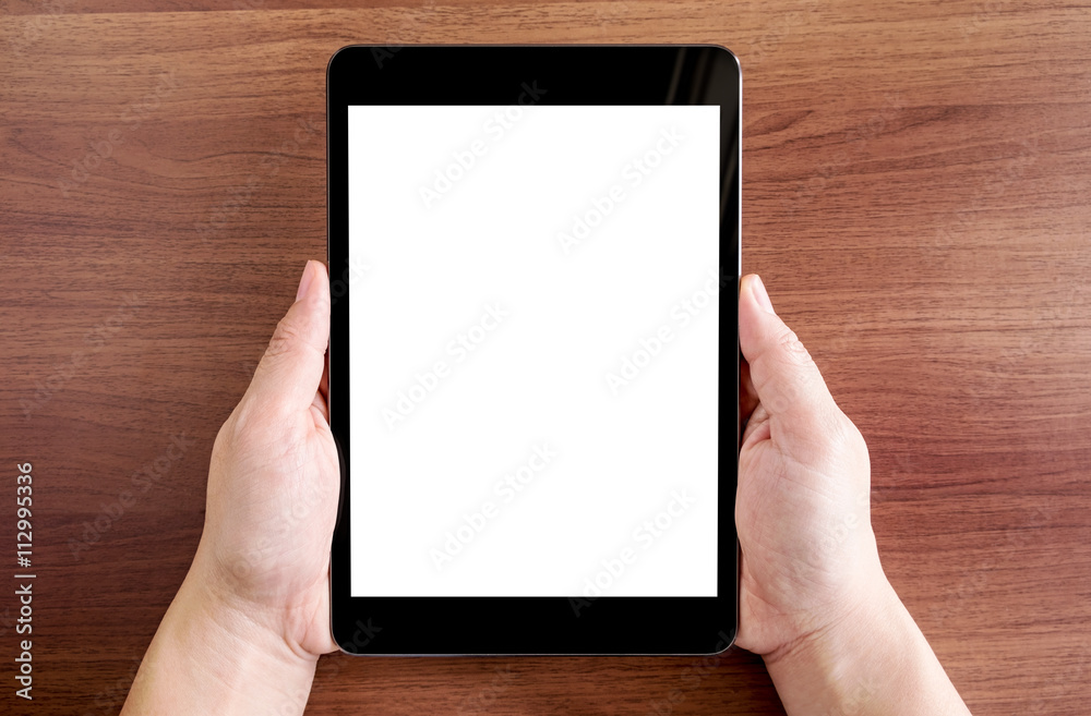 Poster top view of two hand holding tablet with blank white screen on d