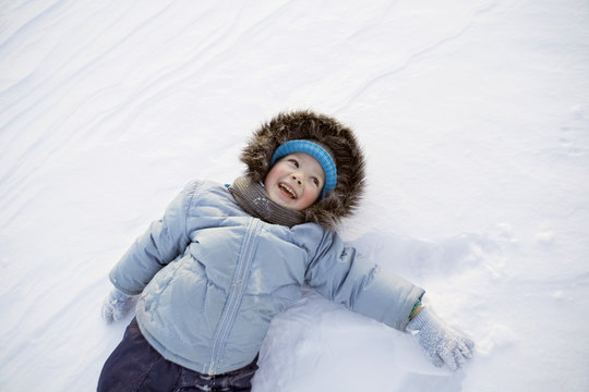 A boy playing in the snow