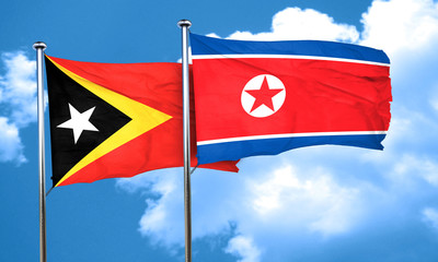 east timor flag with North Korea flag, 3D rendering