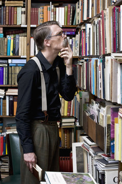 A man scrutinizing books in a bookstore
