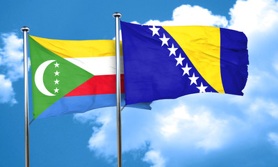 Comoros flag with Bosnia and Herzegovina flag, 3D rendering