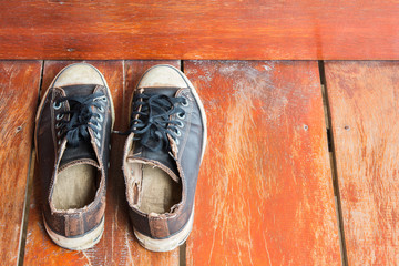 old shoes on a wooden deck