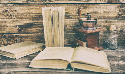 Old books on a wooden background. Vintage composition. Vintage and retro tone