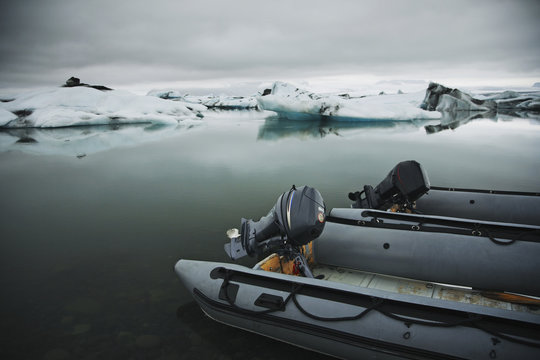 Two outboard motorboats on a glacial lagoon