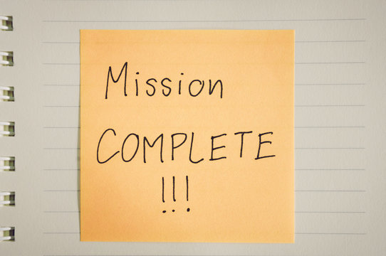 Mission complete words on paper
