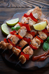 Close-up of grilled shish kebabs with chicken, studio shot