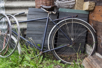 Fototapeta na wymiar old broken bicycle without wheels