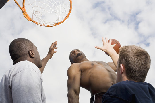 A basketball player preparing to make a slam dunk