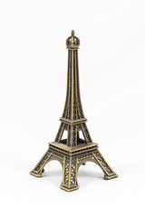 Fototapeta na wymiar Bronze Eiffel Tower model, isolated on white background