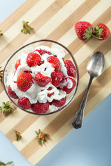 Fresh strawberry served on the wooden board