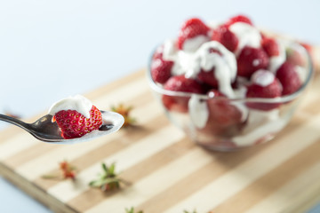 Fresh strawberry served on the wooden board