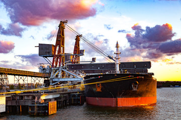 Big ship under loading coal in Port of Gdansk, Poland.