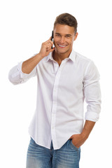Smiling Young Man In A White Shirt On The Phone