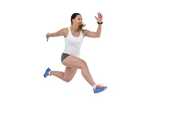 Athletic woman running on white background