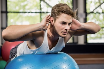 Man working out on fitness ball