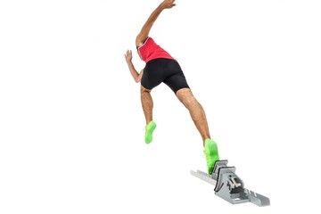 Male athlete running from starting blocks