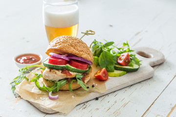Chicken grill burger on wood background