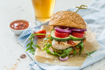 Chicken grill burger on wood background