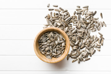 Unpeeled sunflower seeds.