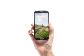 man hand taking picture with smart phone isolated on white backg