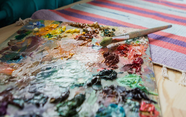 artist brush and palette with paints oil painting impressionism