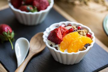 Granola with Orange,Strawberry on yogurt