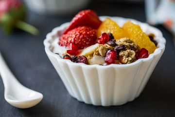 Granola with Orange,Strawberry on yogurt
