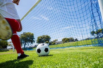 Football player scoring a goal