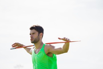 Athlete standing with javelin