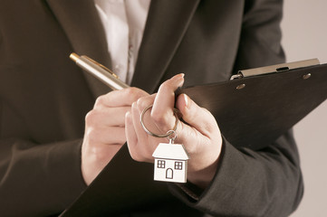 Hand with a house key 