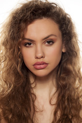 Fototapeta premium skeptical beautiful young woman with a raised eyebrow
