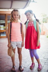 Two cute smilling little girl posing