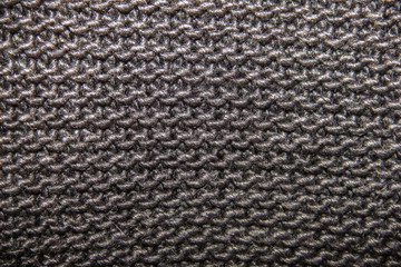 knitted woolen fabric of black color, large loop, texture and ba