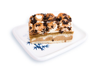 Tiramisu cake on a white plate. isolated on white background