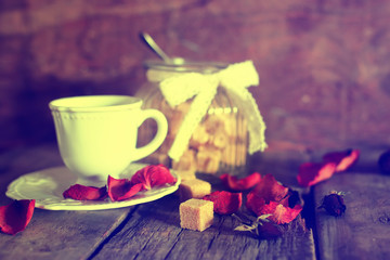 toned photo tea cup with sugar cubes