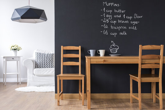 Small dining room with blackboard wall
