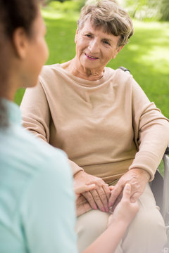 Ill woman with caregiver