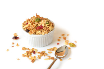 Homemade granola with honey, oatmeal, nuts raisin and cranberry on white background