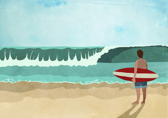 Surfer standing on beach