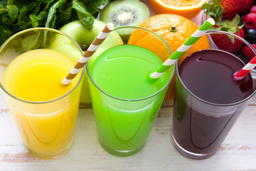 Fresh fruit smoothies on a white wooden background
