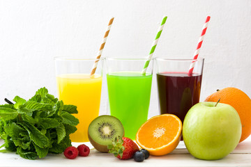 Fresh fruit smoothies on a white wooden background
